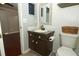 Bathroom featuring tiled floors, updated vanity with mosaic countertop, and a view to the bedroom at 620 Glenwood Ct # 79, Altamonte Springs, FL 32714