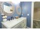 Bathroom with double sinks, decorative mirrors, and a classic white vanity at 620 Glenwood Ct # 79, Altamonte Springs, FL 32714