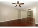 Bedroom featuring gleaming hard wood floors, lighted ceiling fan and closet with mirrored sliding doors at 620 Glenwood Ct # 79, Altamonte Springs, FL 32714