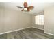 Bedroom featuring light wood-look floors, lighted ceiling fan and window with horizontal blinds at 620 Glenwood Ct # 79, Altamonte Springs, FL 32714