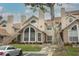 Attractive townhouse showcasing a well-maintained lawn and inviting front entry at 620 Glenwood Ct # 79, Altamonte Springs, FL 32714