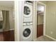 Convenient laundry closet with a stacked washer and dryer unit at 620 Glenwood Ct # 79, Altamonte Springs, FL 32714