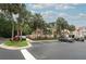 Parking area with palm trees in front of a building at 620 Glenwood Ct # 79, Altamonte Springs, FL 32714