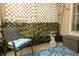 Charming patio area featuring a decorative privacy lattice and a cozy seating arrangement at 620 Glenwood Ct # 79, Altamonte Springs, FL 32714