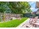 Spacious backyard with a wooden deck, a brick fire pit, and a well-maintained lawn at 638 Boniview Ln, Altamonte Springs, FL 32714