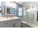 Updated bathroom with a white vanity, marble countertops, and a modern glass-enclosed shower with stylish tile accents at 638 Boniview Ln, Altamonte Springs, FL 32714