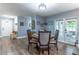 Charming dining room with wood floors, blue walls, and a cozy dining table with seating for four at 638 Boniview Ln, Altamonte Springs, FL 32714
