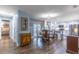 Bright open concept: Dining room flows into a modern kitchen with stainless steel appliances and island seating at 638 Boniview Ln, Altamonte Springs, FL 32714