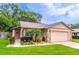 Charming single-story home featuring manicured landscaping and a stone accent facade at 638 Boniview Ln, Altamonte Springs, FL 32714