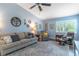 Bright living room with neutral tones, large windows, and a comfortable seating area at 638 Boniview Ln, Altamonte Springs, FL 32714