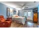 Serene main bedroom featuring soft blue walls, a ceiling fan, and access to the outdoors through French doors at 638 Boniview Ln, Altamonte Springs, FL 32714