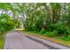 Quiet street lined with lush greenery and trees, offering a serene and peaceful neighborhood setting at 638 Boniview Ln, Altamonte Springs, FL 32714