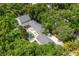 Aerial view of a beautiful estate with a private pool, patio and verdant greenery at 685 Mayo Ave, Maitland, FL 32751
