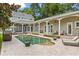 Expansive backyard featuring a large pool, covered patio, and lush landscaping for ultimate outdoor living at 685 Mayo Ave, Maitland, FL 32751
