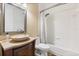 Bathroom featuring a stone bowl sink, vanity and a shower/tub with curtain at 685 Mayo Ave, Maitland, FL 32751
