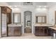 Bathroom with double vanities, mirrors, dark wood cabinetry, and ample storage at 685 Mayo Ave, Maitland, FL 32751