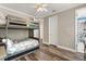 Spacious bedroom with a bunk bed, ceiling fan, and wood floors at 685 Mayo Ave, Maitland, FL 32751