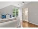 Bright bedroom with a large window, hardwood floors and an ensuite bathroom at 685 Mayo Ave, Maitland, FL 32751
