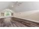 Spacious bonus room with a large window, built-in shelves, and wood floors at 685 Mayo Ave, Maitland, FL 32751