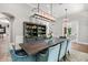 Spacious dining room featuring a stylish chandelier, serving hutch, and elegant decor for sophisticated gatherings at 685 Mayo Ave, Maitland, FL 32751
