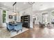 Elegant dining room features a statement light fixture, plush blue chairs, and decorative built-in shelving at 685 Mayo Ave, Maitland, FL 32751