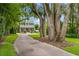 Charming two-story home with a welcoming front porch and a brick-paved driveway at 685 Mayo Ave, Maitland, FL 32751