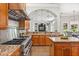 Gourmet kitchen features stainless steel appliances, a spacious island and granite countertops at 685 Mayo Ave, Maitland, FL 32751