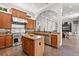 Kitchen with stainless steel appliances, wooden cabinets, and granite countertops at 685 Mayo Ave, Maitland, FL 32751
