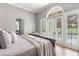 Bright main bedroom with large windows offering stunning outdoor views and filling the room with natural light at 685 Mayo Ave, Maitland, FL 32751