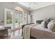 Main bedroom features a neutral palette, large windows and private access to the outdoors at 685 Mayo Ave, Maitland, FL 32751