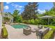 Gorgeous backyard with a private pool, lounge area, and lush landscaping perfect for relaxation and entertainment at 685 Mayo Ave, Maitland, FL 32751