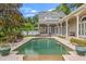Stunning pool area surrounded by lush greenery and an expansive patio, creating a perfect outdoor retreat at 685 Mayo Ave, Maitland, FL 32751