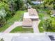 An aerial view of the home and surrounding green lawn, trees and brick driveway at 740 Florida Blvd, Altamonte Springs, FL 32701