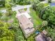 Aerial view of house with brick driveway and manicured yard surrounded by mature trees at 740 Florida Blvd, Altamonte Springs, FL 32701