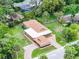 An aerial view of the home showcasing a large yard, roof, pool, and the surrounding neighborhood at 740 Florida Blvd, Altamonte Springs, FL 32701
