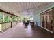 Large covered porch perfect for entertaining, complete with string lights and outdoor furniture at 740 Florida Blvd, Altamonte Springs, FL 32701