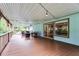 Expansive covered porch featuring ample seating, string lights, and access to interior via sliding glass doors at 740 Florida Blvd, Altamonte Springs, FL 32701
