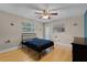 A cozy bedroom with a ceiling fan, hardwood floors, and themed decorations perfect for a room at 740 Florida Blvd, Altamonte Springs, FL 32701