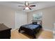 This bedroom has a large window, wood floors and a double door closet at 740 Florida Blvd, Altamonte Springs, FL 32701