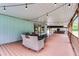 Spacious covered deck featuring outdoor seating and stylish string lights for evening enjoyment at 740 Florida Blvd, Altamonte Springs, FL 32701