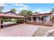 Property featuring a porte-cochere, wide front porch with swing, brick driveway, and gravel-lined walkway at 740 Florida Blvd, Altamonte Springs, FL 32701