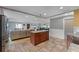 Open concept living area with a kitchen island and stainless steel appliances at 740 Florida Blvd, Altamonte Springs, FL 32701