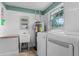 Laundry room has a washing machine, dryer and a laundry sink at 740 Florida Blvd, Altamonte Springs, FL 32701