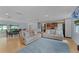Expansive open-concept living area with hardwood floors connecting the living room and dining space at 740 Florida Blvd, Altamonte Springs, FL 32701