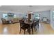 Spacious living and dining area with hardwood floors and natural light from many windows at 740 Florida Blvd, Altamonte Springs, FL 32701
