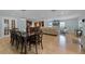 Open-concept living space with hardwood floors, modern furnishings, and plenty of natural light at 740 Florida Blvd, Altamonte Springs, FL 32701