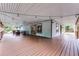 Expansive covered porch with string lights, comfortable seating, and a view of the backyard at 740 Florida Blvd, Altamonte Springs, FL 32701