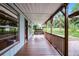 Spacious covered front porch with a swing, offering an inviting outdoor space at 740 Florida Blvd, Altamonte Springs, FL 32701