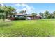View of the home from the large grass yard showing decks and covered patios at 740 Florida Blvd, Altamonte Springs, FL 32701