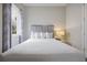 Relaxing bedroom with a queen bed, stylish curtains, and a calming ambiance at 7740 Sandy Ridge Dr # 114, Reunion, FL 34747